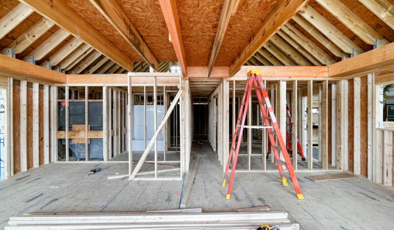 This is a photograph of the interior of a modular home that is under construction. It shows the 2x6 exterior wall construction.